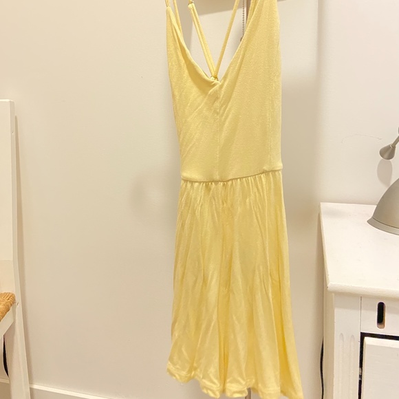 Light Yellow Flowy Romper with Criss Cross Back- Urban Outfitters. - Picture 1 of 1